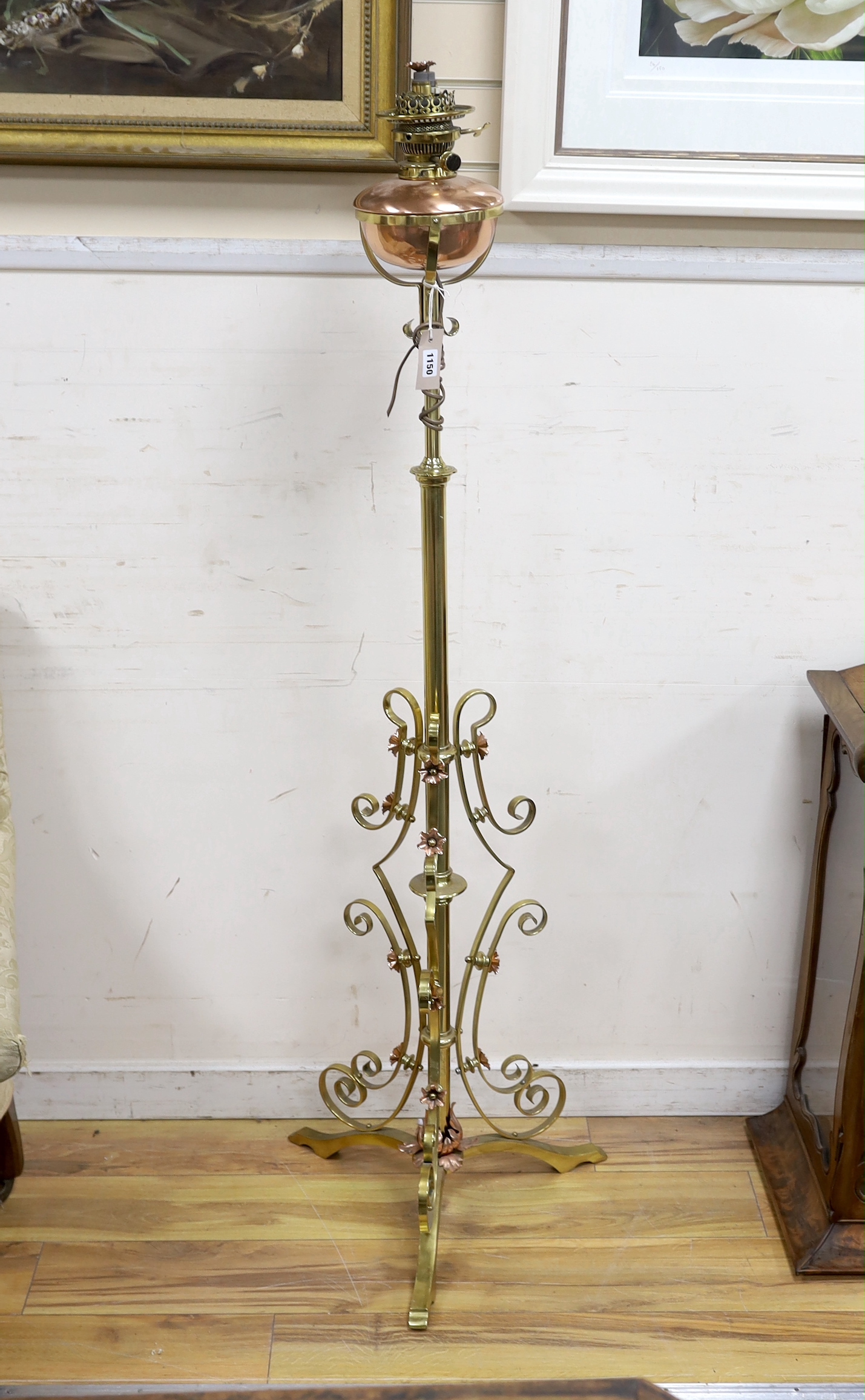 A late Victorian copper and brass telescopic oil standard lamp converted to electricity, height 156cm